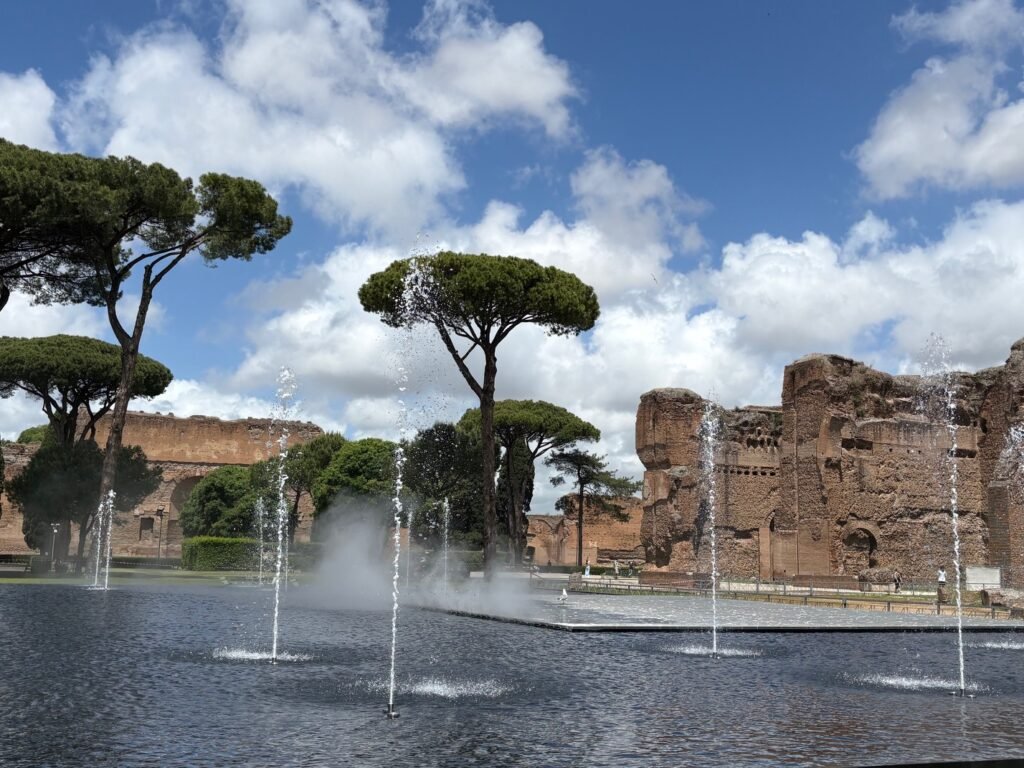 Fountains, umbrella pines and ancient ruins at the Baths of Caracalla.