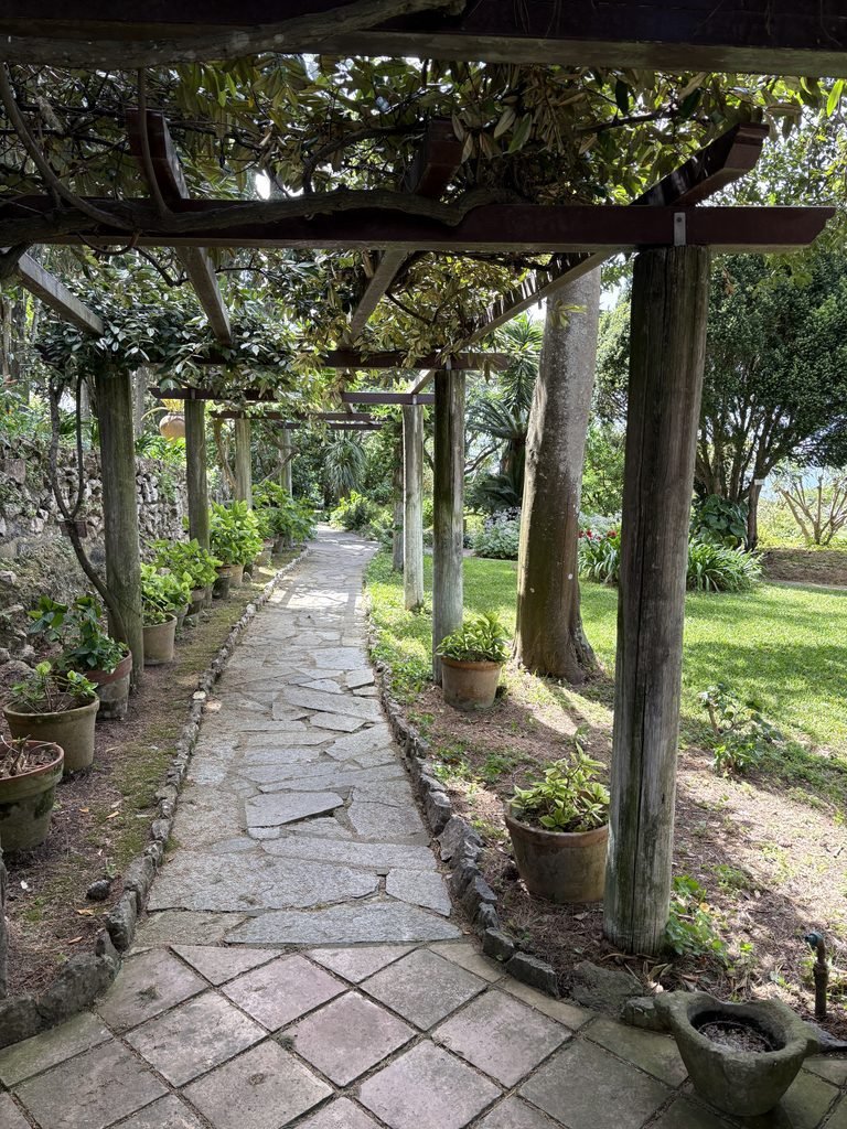 Gardens at Villa San Michele including a walkway under a trellis