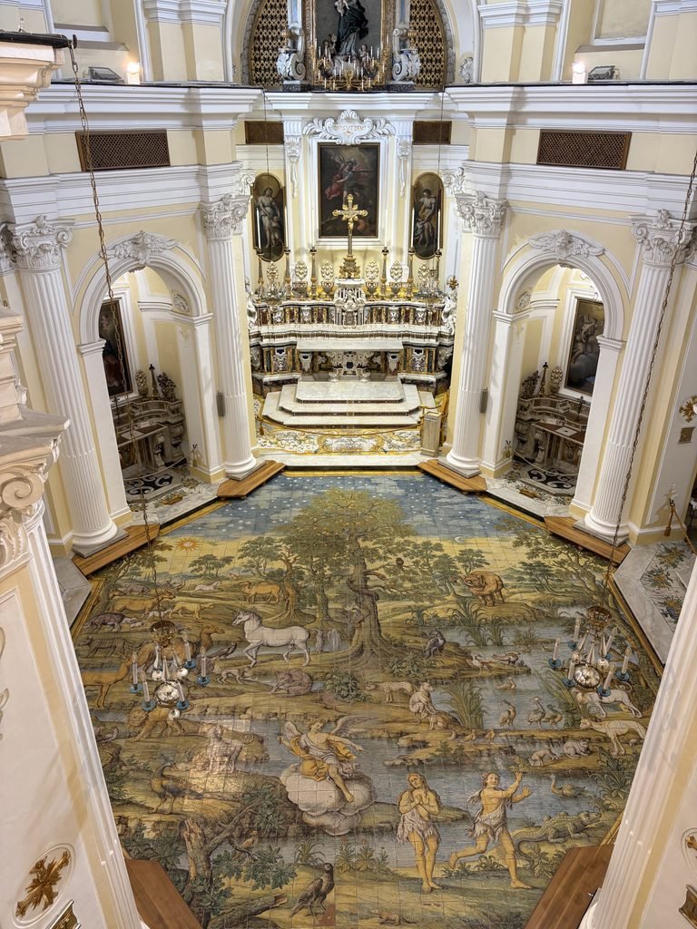 Tiled floor depicting the expulsion of Adam and Eve inside San Michele Arcangelo in Anacapri.